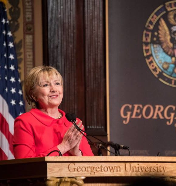 Hillary Clinton speaks from a podium at Georgetown