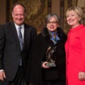 Hillary Clinton bestows an award upon Maria Paulina Riveros at Georgetown University