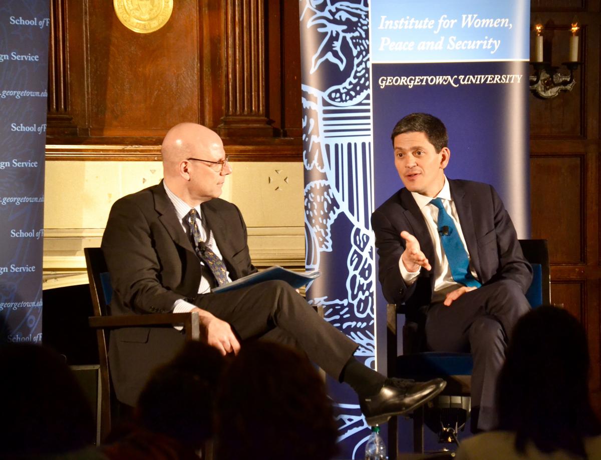 David Miliband and Joel Hellman on stage