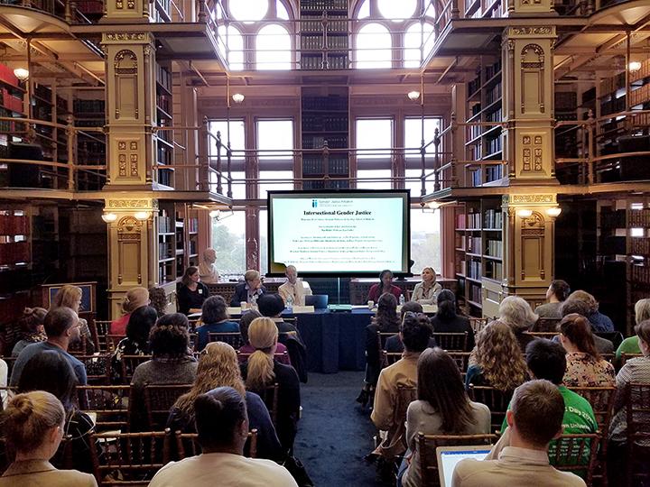 panelists at the Gender Justice Colloquium last year met in Riggs Library of Georgetown University.