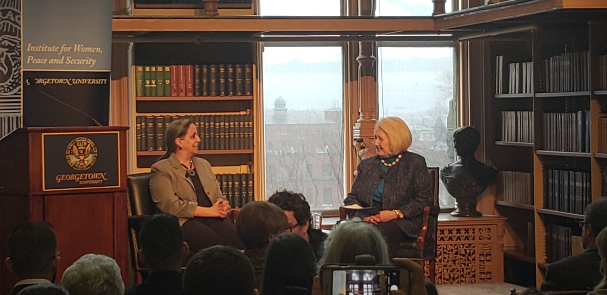 Ambassador Verveer and Dr. Klugman speaking in Riggs Library.