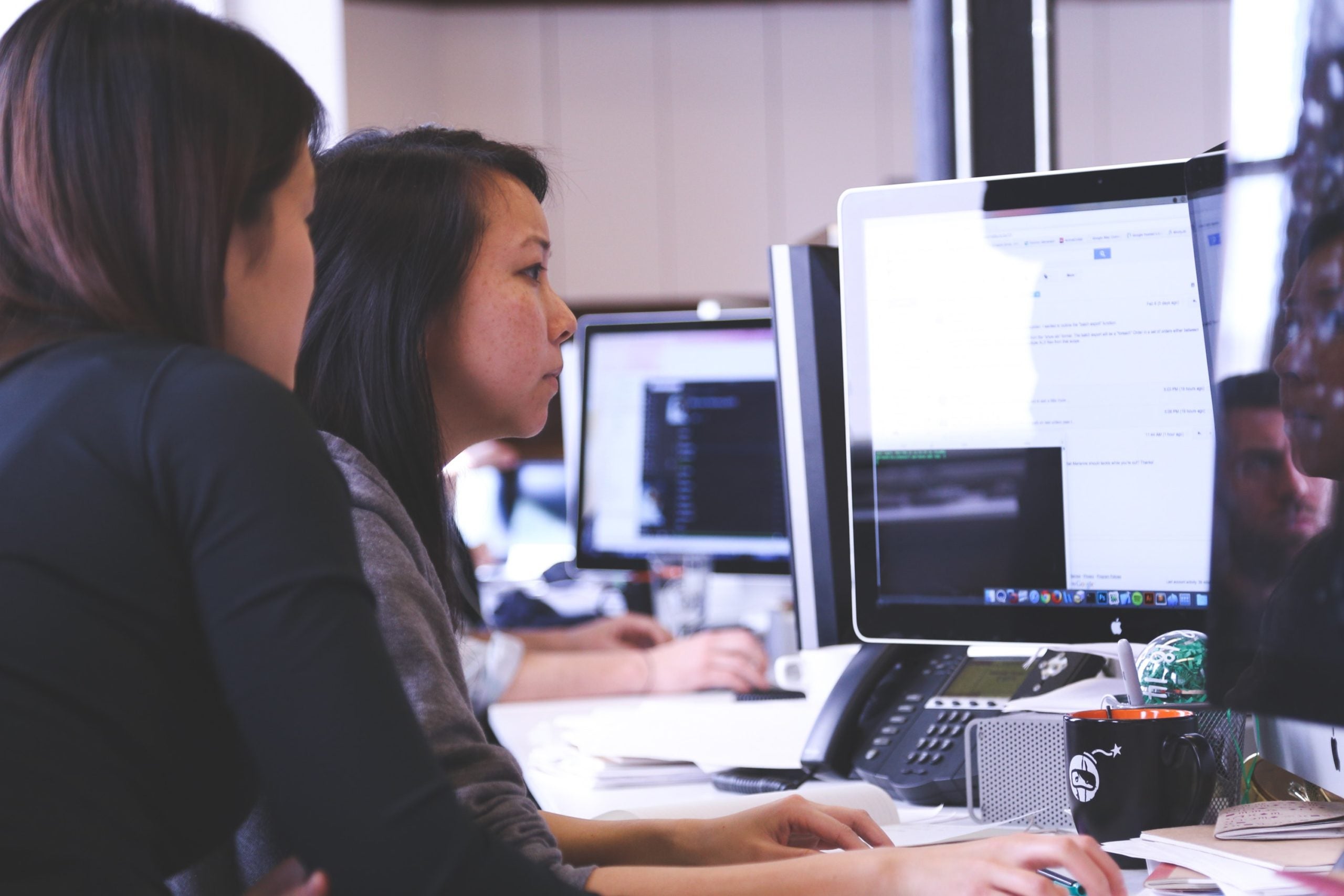 Women working at a computer.