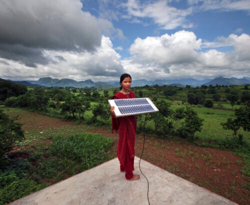 Women holds solar panel