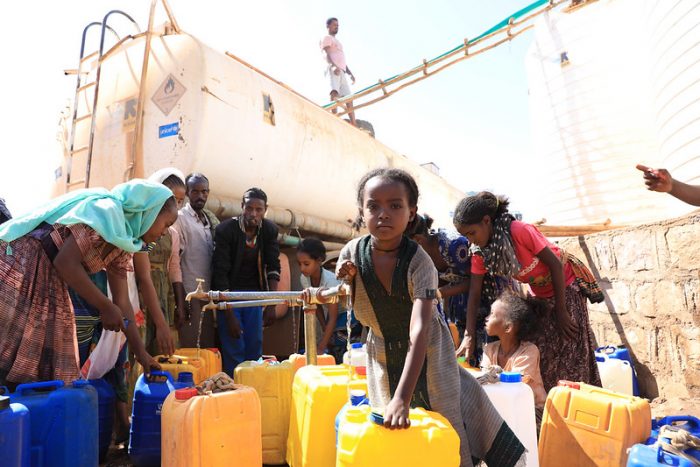 An image of internally displaced women and girls who left their homes as a result of the Tigray crisis shows the impact of the violence described on this page.