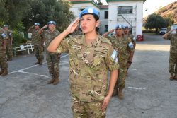 A decorative image taken from the report mentioned on this page shows a woman soldier in a peacekeeping uniform saluting.