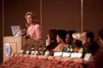 A decorative image of then-First Lady Hillary Rodham Clinton at the 1995 Beijing Conference is included to give the viewer a snapshot from the Conference, which is the subject of the event described on this page.