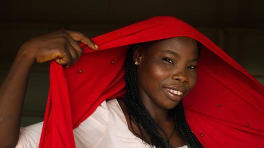 A photo of Laraba, the woman described in the story on this page, is included to give the reader an idea of what she and her community look like.