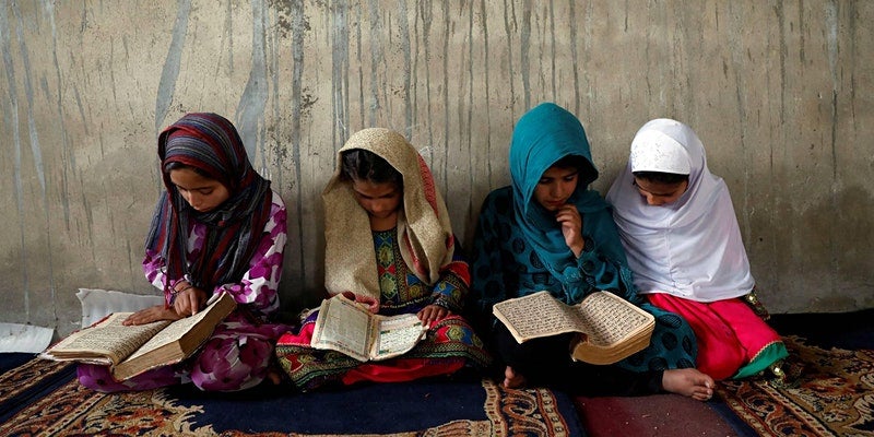 An image of Afghan girls reading books is included to reference the theme of the event described on this page.